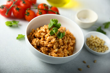 Homemade chicken ragout with pine nuts