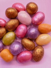 beautiful multicolored nut candy in chocolate colored glaze. aesthetic photos, fashionable colors....