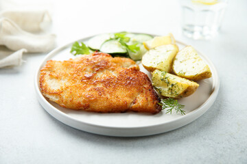 Traditional homemade schnitzel with potatoes