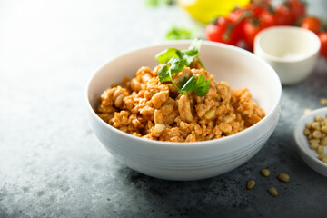 Homemade chicken ragout with pine nuts