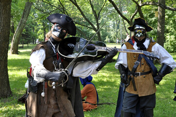 play the guitar like a violin with a sword