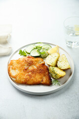 Traditional homemade schnitzel with potatoes