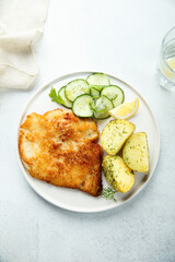 Traditional homemade schnitzel with potatoes