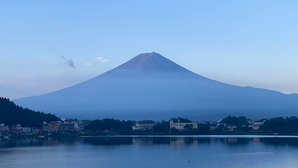 Magnificent Japanese traditional view, Mt Fuji at just after 5:30 am, the beautiful silhouette revealed in whole after cloudy evening the day before.  Photo taken year 2022 August 27th