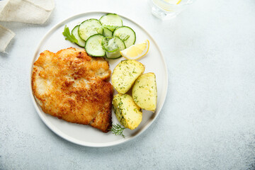 Traditional homemade schnitzel with potatoes