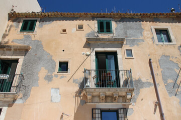 ancient palace or flat building in syracusa in sicily (italy)