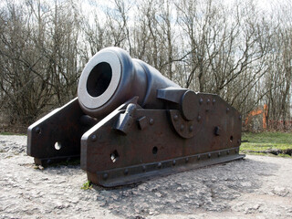 Mortar, an ancient short-barreled gun of large caliber. Vintage bronze cannons close-up, historical...