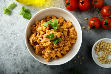 Homemade chicken ragout with pine nuts