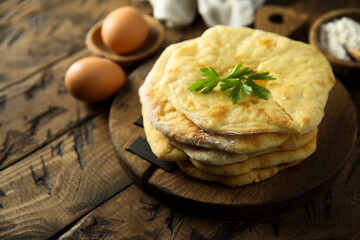 Traditional homemade flatbread on a wooden desk