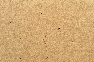 A sheet of brown recycled craft paper texture as background
