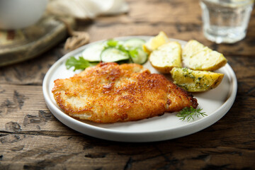 Traditional homemade schnitzel with potatoes