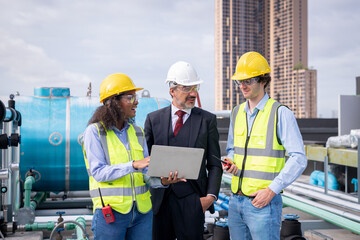 engineer under checking the industry cooling tower air conditioner is water cooling tower air...