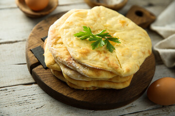 Traditional homemade flatbread on a wooden desk