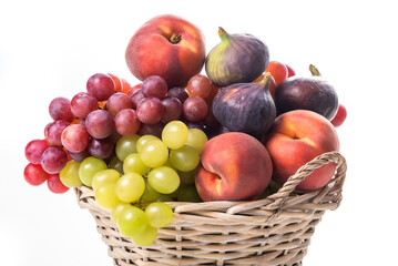Fruit basket. Grapes, figs and peaches