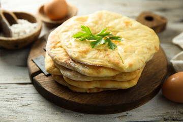 Traditional homemade flatbread on a wooden desk