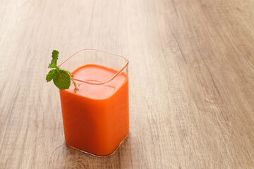 A glass of fresh carrot juice, very good for health. Served in glass. Cold Pressed Juice
