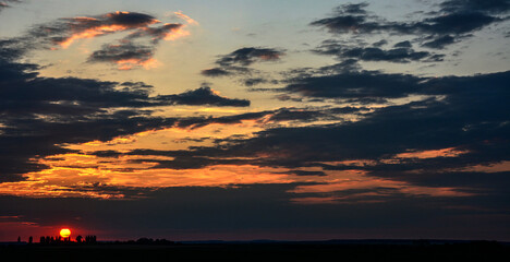 abstract background of cloudy sunset sky golden hour
