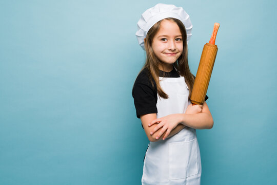 Smart girl dreaming of becoming a baker or chef