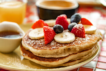 Belgian pancakes served with fruits and maple syrup - obrazy, fototapety, plakaty