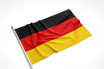 German Flag is Laying on a White Surface