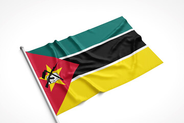 Mozambique Flag is Laying on a White Surface