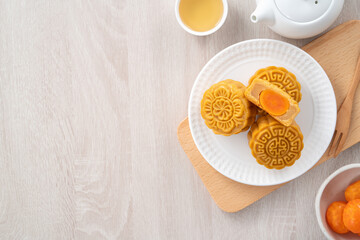 Delicious Cantonese moon cake for Mid-Autumn Festival food mooncake on wooden table background.