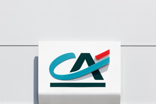 Fumel, France - June 25, 2021: Credit Agricole logo on a wall. Credit Agricole is a French network of cooperative and mutual banks comprising the 39 Credit Agricole Regional Bank