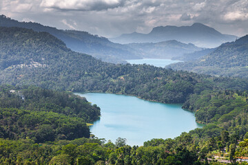Fototapeta na wymiar Magnificent lakes among the jungle of the island of Sri Lanka under thunderclouds