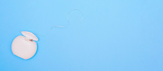 Dental floss on a blue background.