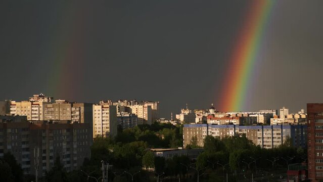 rainbow over the city, double rainbow after rain