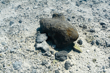 volcanic bomb among the tephra on the slope of the volcano close-up