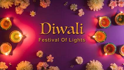 Happy Diwali - Clay Diya lamps lit during Dipavali, Hindu festival of lights celebration. Colorful...