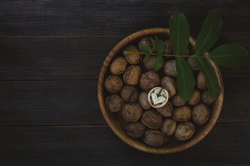 Walnuts on a dark wooden background