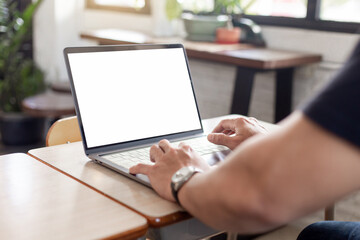 computer screen blank mockup.hand woman work using laptop with white background for advertising,contact business search information on desk at coffee shop.marketing and creative design