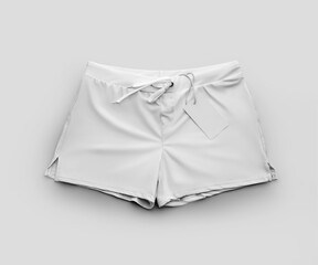 Mockup of male swimming trunks, subject with tag close-up, isolated on background, front view.