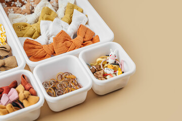 Organizer with fashion hair bows, hairpins and hair elastics. Organizing and Storage Ideas. Baby Girl hair accessory. Hairstyles for girls with bows. Close up