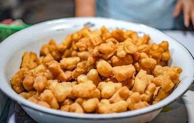 Patongko put in a basin for sale in a fresh market in Ubon Ratchathani, Thailand.