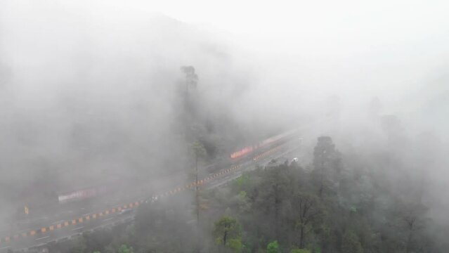 Aerial Birds Eye View Of Muree Expressway Through Dense Mist