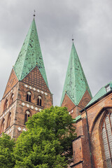 Fototapeta na wymiar The twin towers of St. Mary's Church in Lubeck, the mother church of brick Gothic