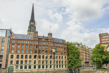 St. Nicholas Church peeking above the surrounding buildings. The bombing of Hamburg in World War II destroyed the bulk of the church