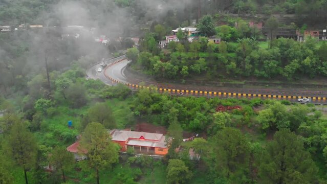 Drone Flying Forward Towards Four Lane E75 Expressway On Misty Foggy Day