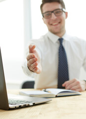 Businessman extending hand to shake