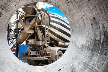 Concrete mixer truck in front of a concrete batching plant, cement factory. Loading concrete mixer...