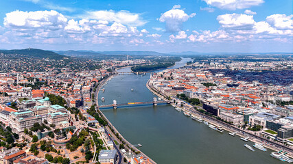 Obraz premium Budapest, Hungary aerial panoramic skyline view of Buda Castle Royal Palace with Szechenyi Chain Bridge, St.Stephen's Basilica, Hungarian Parliament and Matthias Church on a summer day with blue sky