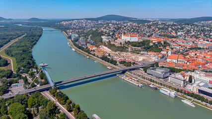 Bratislava aerial cityscape view on the old town with Saint Martin's cathedral, Bratislava Castle and Danube river on a sunny summer day in Slovakia.