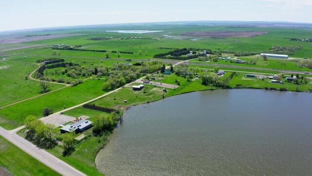 Fishing Pond Surrounded By Green Fields In Bismarck, North Dakota, USA. Aerial