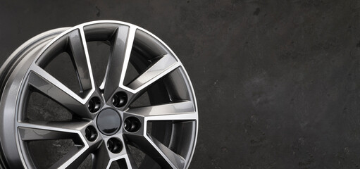 grey beautiful stylish alloy wheel details on a dark background copy space autotuning