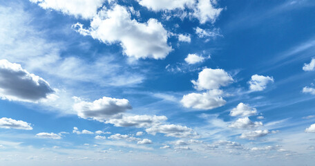 White clouds against blue sky background