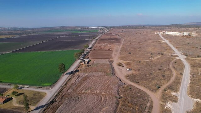 Aerial pull back of large plot of compost farm land in mexico
