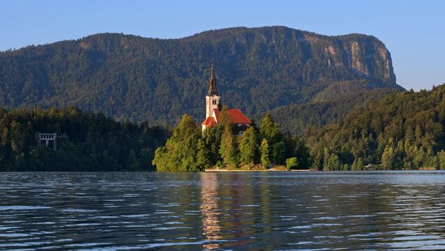 Lake Bled and Bled Island at sunrise in Slovenia. On the island pilgrimage Church of the Assumption of Mary.